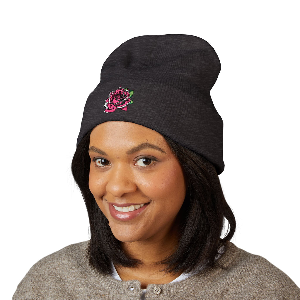 Person wearing a green beanie with 'Never Alone' logo on a white background