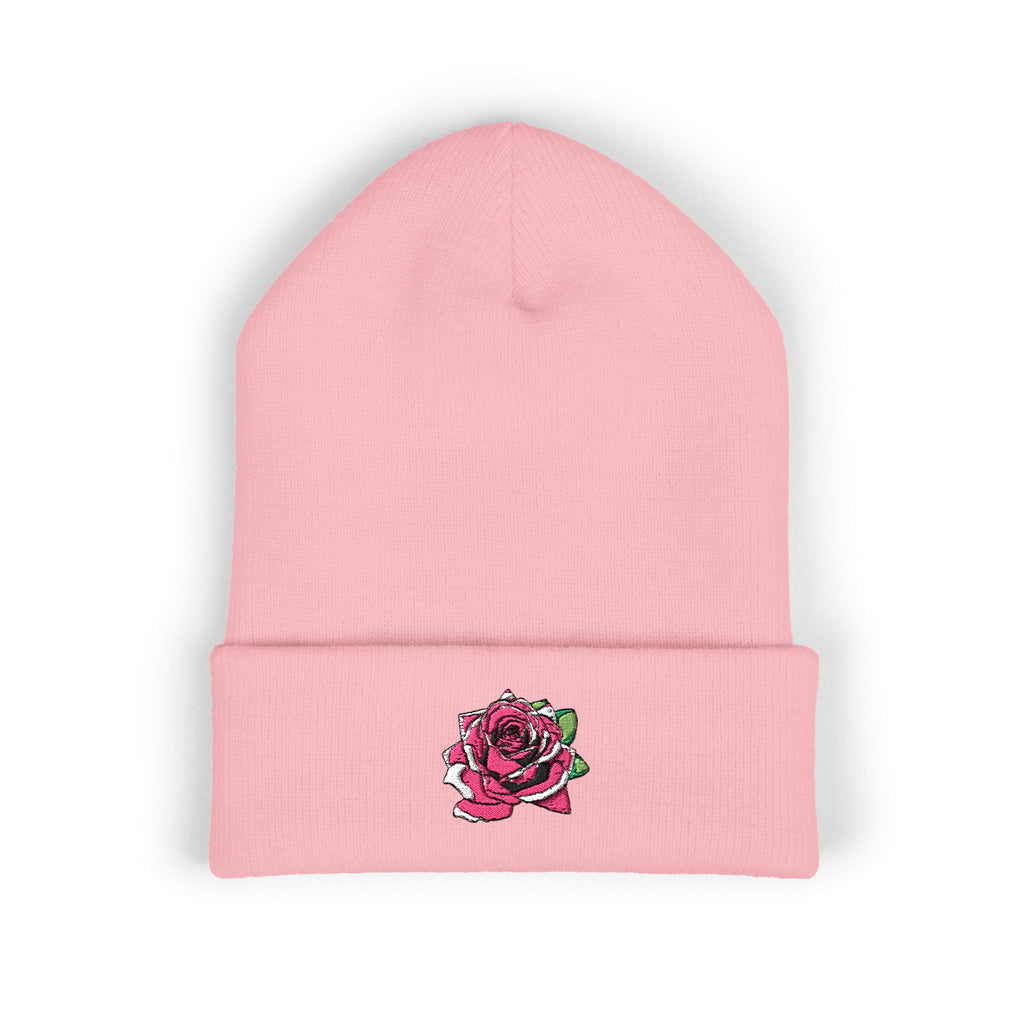 Pink beanie with a rose design on a white background