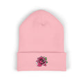 Pink beanie with a rose design on a white background