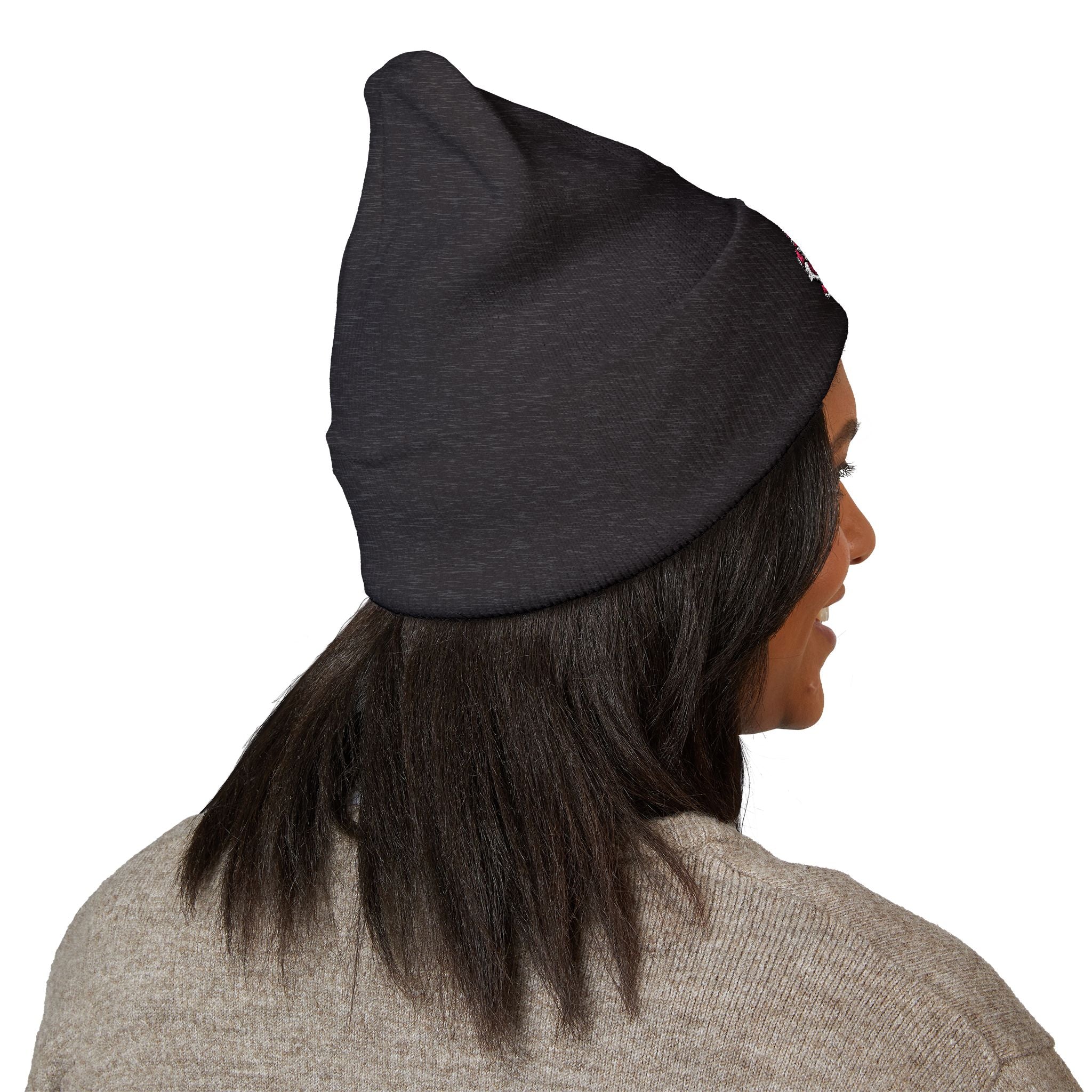 Person wearing a black beanie on a white background