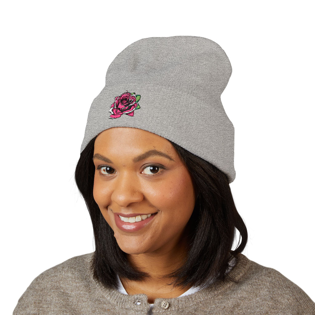 Person wearing a gray beanie with 'Copperhead Coffee' text on a white background