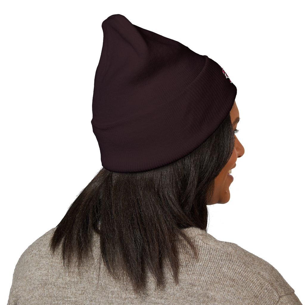 Person wearing a black headscarf on a white background