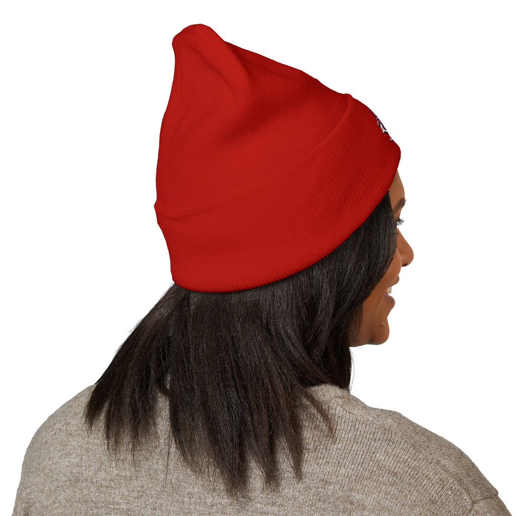 Person wearing a red beanie on a white background